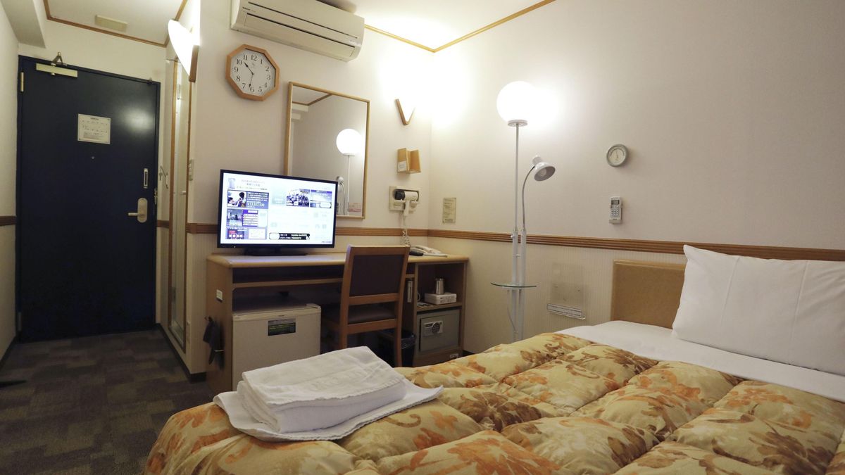 Photo taken April 7, 2020, shows a guest room of a central Tokyo hotel operated by Japanese chain Toyoko Inn Co. The hotel is one of the designated lodging facilities to which the metropolitan government will transfer coronavirus patients with mild or no symptoms to prioritize in-hospital treatment for those with severe symptoms. (Photo by Kyodo News via Getty Images)