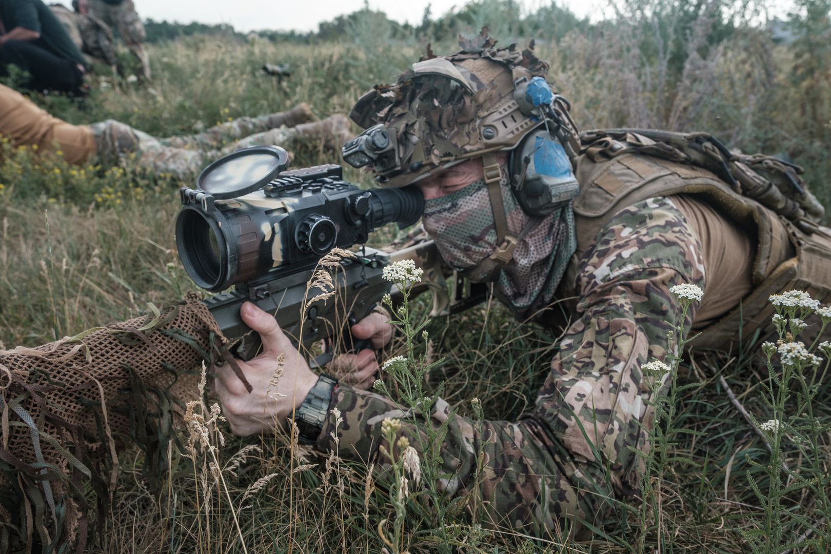 DONETSK OBLAST, UKRAINE - JULY 9: Sniper of the 1st brigade of National Guard "Bureviy' takes part in a military training in Donetsk Oblast, Ukraine on July 9, 2024. Ukrainian snipers are highly trained and capable of causing damage, and are therefore a priority target for Russian troops. Their frontline tasks include shooting down soldiers at Russian observation posts, providing observation to assist artillery fire, and stopping Russian waves when they attack. (Photo by Pablo Miranzo/Anadolu via Getty Images)