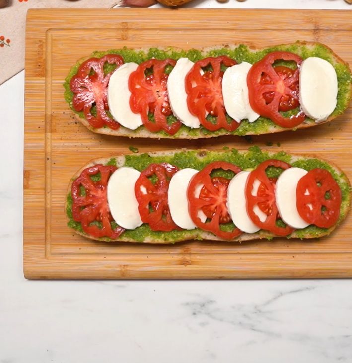 Baguettes with mozzarella, pesto, and tomato