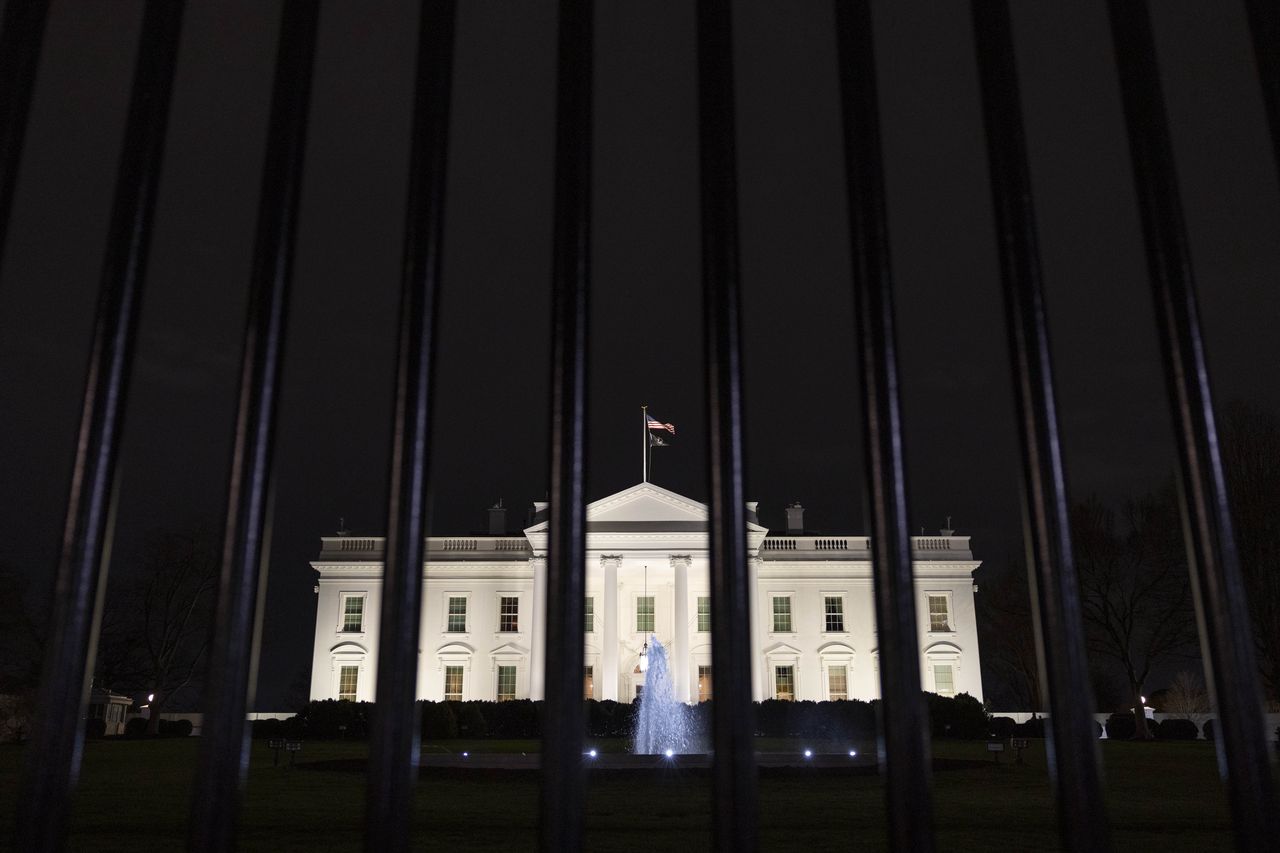 WASHINGTON, D.C. - JANUARY 12: The White House is seen through a security fence in Washington on January 12, 2023.  (Amanda Andrade-Rhoades/For The Washington Post via Getty Images)