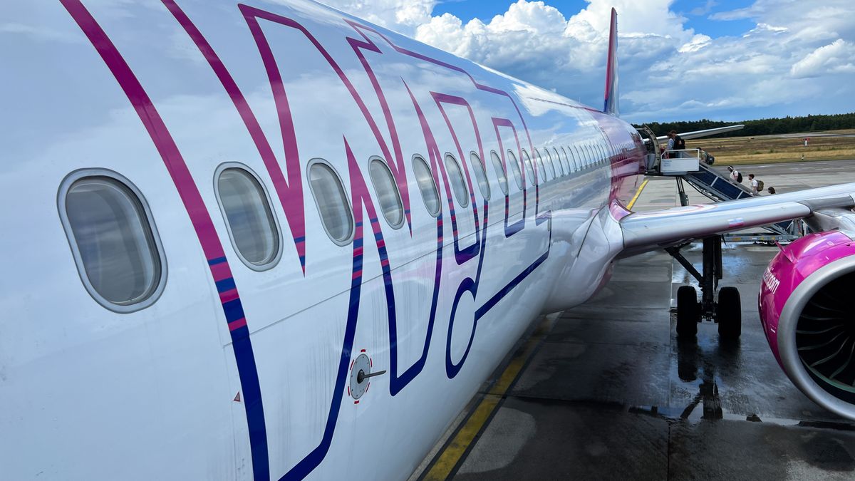 adventure, air, aircraft, airline, airliner, airplane, airport, atmosphere, aviation, blue, boarding, branding, bright, budget, clear, cloud, color, cost, departure, design, europe, excitement, fin, friendly, gate, group, holiday, journey, logo, low, luggage, movement, outdoor, passenger, passing, people, service, sky, sunny, symbol, tail, terminal, transportation, travel, vacation, walking, white, wing, wizzair