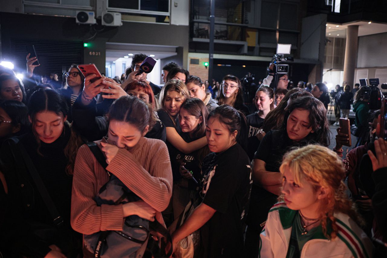 BUEONES AIRES, ARGENTINA - OCTOBER 16: Fans of One Direction and Liam Payne gathered outside the hotel to sing the band's songs and leave a candle at an improvised altar after British musician Liam James Payne, composer, guitarist, and former member of the band, died on Wednesday, October 16, 2024 in Bueones Aires, Argentina. He fell from the third floor of a hotel in the Palermo neighborhood of Buenos Aires, Argentina, according to police sources. (Photo by Luciano Gonzalez/Anadolu via Getty Images)