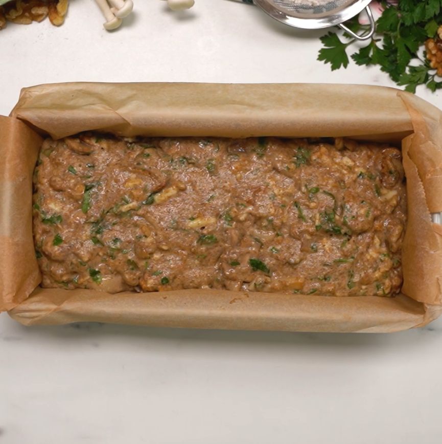 A risen bread with mushrooms and nuts