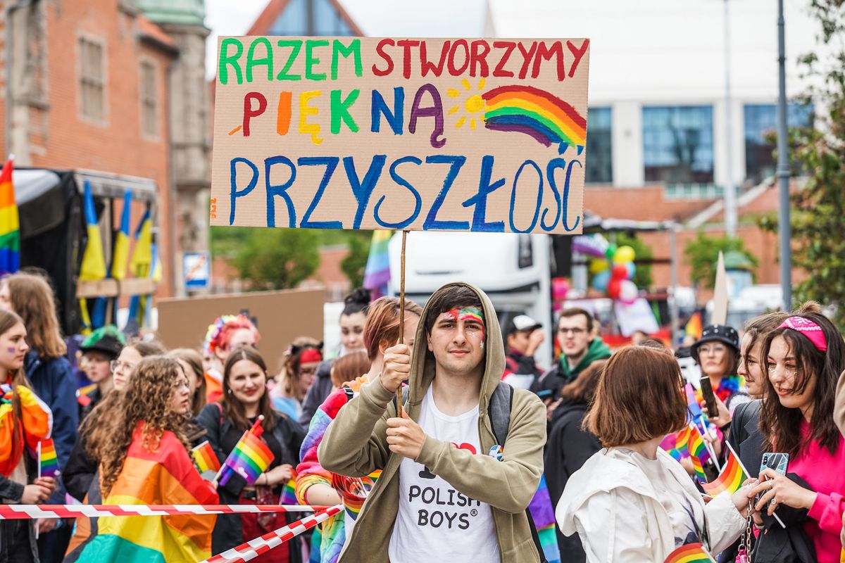 Gay pride participants holding rainbow (LGBT movement) flags and banners with equality and pro-gay slogans are seen in Gdansk, Poland on 28 May 2022 Equality march was organized by the gay rights movements  to support LGBTQ (gay,lesbian,bisexual,transgender and queer) people rights in Poland. March was highly guarded by the anti-riot police unit. (Photo by Michal Fludra/NurPhoto via Getty Images)