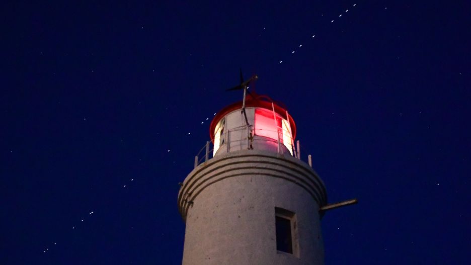 VLADIVOSTOK, RUSSIA - APRIL 27, 2020: 60 of the Starlink Internet communication satellites of Elon Musk's SpaceX private spaceflight company seen in the night sky. On April 22, 2020, SpaceX successfully launched 60 Starlink satellites into orbit on the Falcon 9 rocket from NASA's Kennedy Space Center at Cape Canaveral. The Starlink project is aimed at providing low-cost internet to remote locations; SpaceX is planning to launch into orbit about 30,000 satellites. Following the launch of the first batch of the Starlink satellites, the International Astronomical Union (IAU) and the US National Radio Astronomy Observatory (NRAO) expressed concerns about the satellites being too bright and forming a 'megaconstellation' and thus causing serious problems for astronomers.  Yuri Smityuk/TASS (Photo by Yuri Smityuk\TASS via Getty Images)