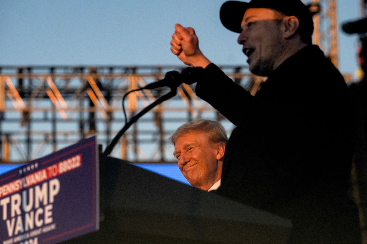 Elon Musk, chief executive officer of Tesla Inc., right, and former US President Donald Trump during a campaign event at the Butler Farm Show in Butler, Pennsylvania, US, on Saturday, Oct. 5, 2024. Republican nominee Donald Trump rallied supporters at the site of a July assassination attempt, returning to the Pennsylvania venue where a gunman's bullet bloodied his ear and upended the presidential campaign. Photographer: Justin Merriman/Bloomberg via Getty Images