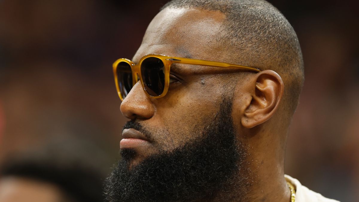 PHOENIX, ARIZONA - APRIL 05: LeBron James #6 of the Los Angeles Lakers watches from the bench during the first half of the NBA game against the Phoenix Suns at Footprint Center on April 05, 2022 in Phoenix, Arizona.   The Suns defeated the Lakers 121-110. NOTE TO USER: User expressly acknowledges and agrees that, by downloading and or using this photograph, User is consenting to the terms and conditions of the Getty Images License Agreement. (Photo by Christian Petersen/Getty Images)