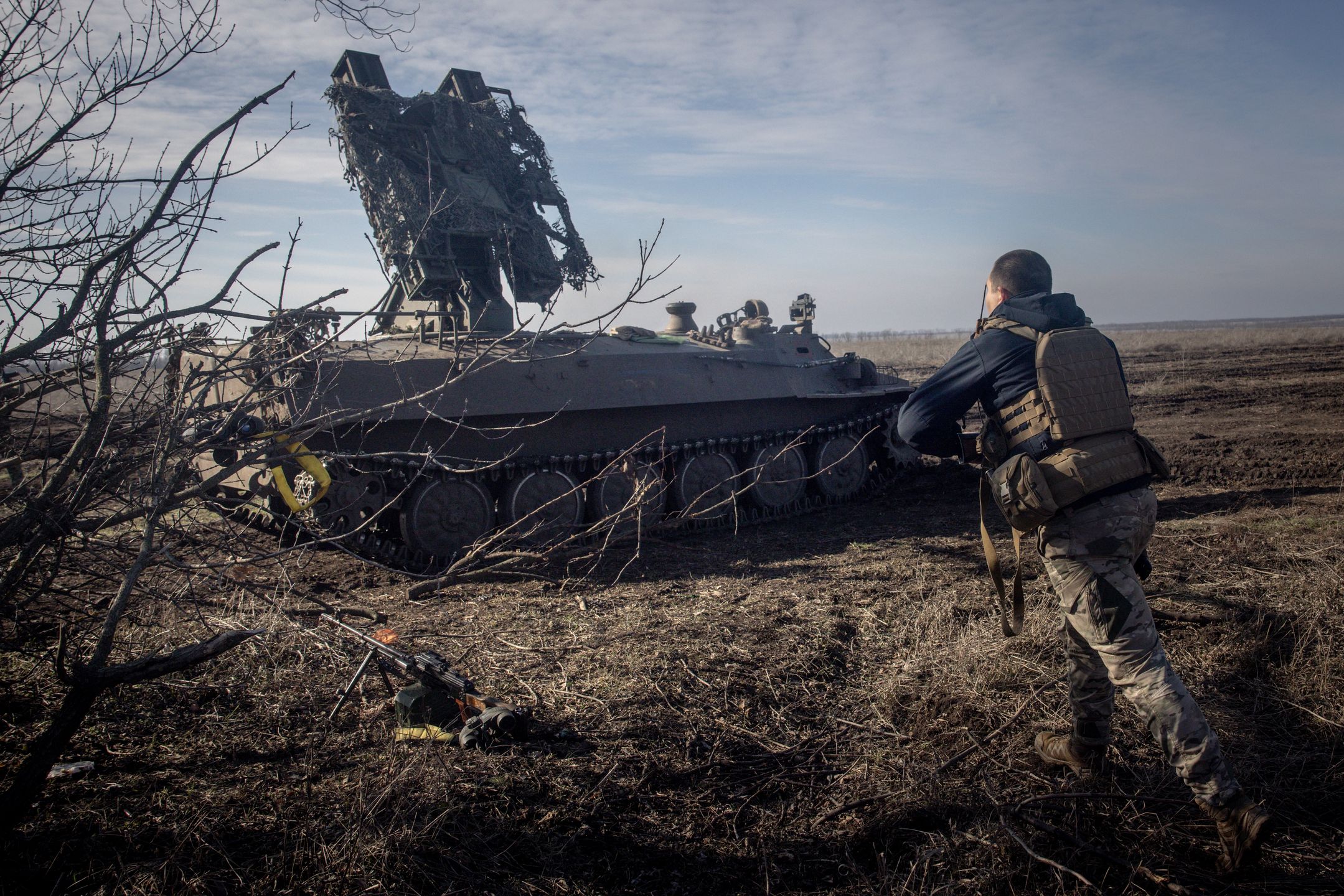 MARINKA, UKRAINE - FEBRUARY 23:  A member of Ukraine's 72nd Brigade Anti-air unit runs to a position as they prepare to fire a Strela -10 anti-air missile system after sighting a Russian Zala reconnaissance drone over head on February 23, 2024 near Marinka, Ukraine. February 24 will mark two years since Russia's large-scale invasion of Ukraine, which has left tens of thousands dead and many more wounded, although neither country releases official casualty figures. The war has also sparked economic insecurity around the world, further isolated Russia from the West, and, while initially galvanising NATO countries, has exposed tensions between Western allies over the scale and duration of military support to Ukraine. Two years on, the war shows no sign of ending, even while the frontlines have changed very little in recent months. (Photo by Chris McGrath/Getty Images)
