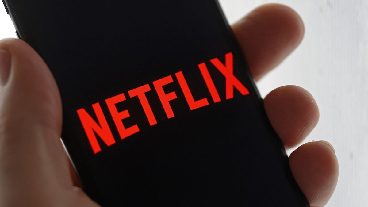 PARIS, FRANCE - NOVEMBER 05: In this photo illustration, the Netflix media service provider's logo is displayed on the screen of an iPhone on November 05, 2024 in Paris, France. The National Financial Prosecutor's Office (PNF) and police officers from the anti-corruption office are conducting all-out searches this morning targeting the French subsidiary of Netflix. An investigation has been opened for "aggravated tax fraud laundering" and "concealed work in an organized gang". (Photo illustration by Chesnot/Getty Images)
