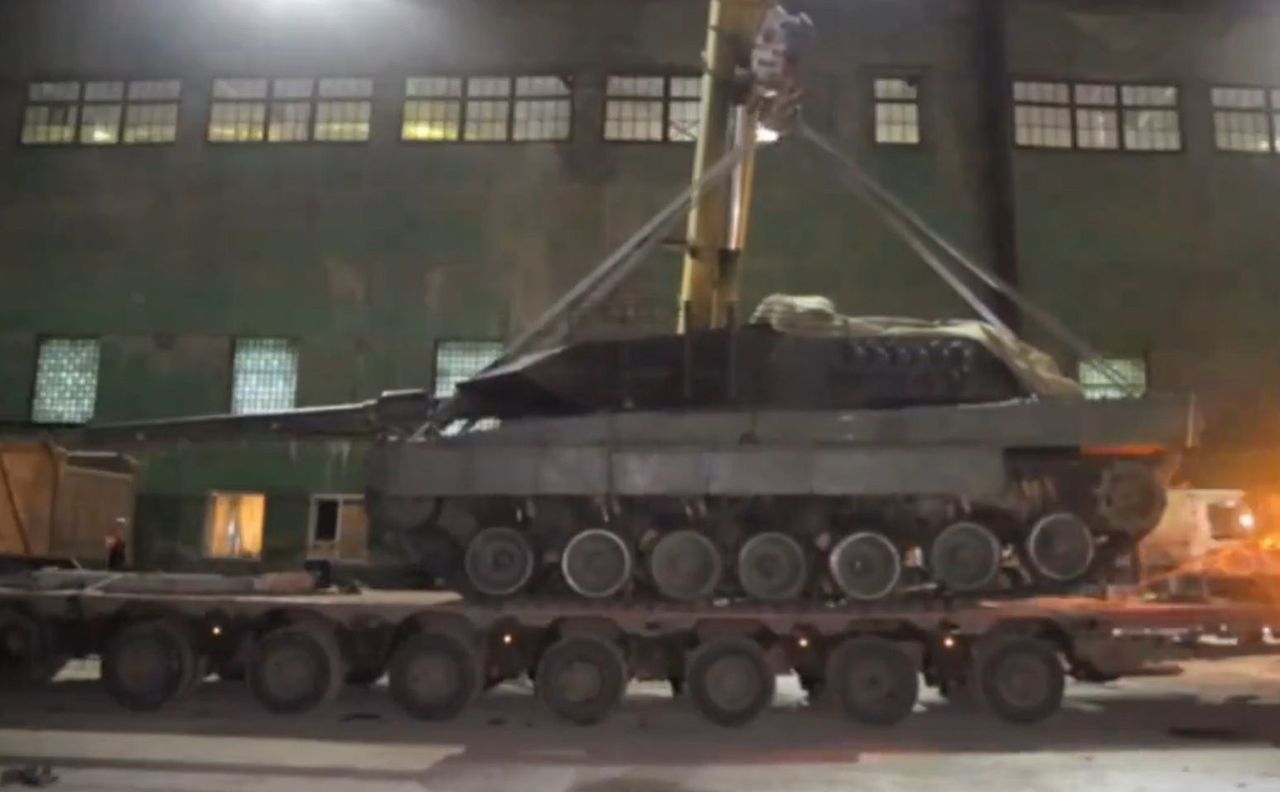 The Russians are examining a captured Leopard 2A6 tank.