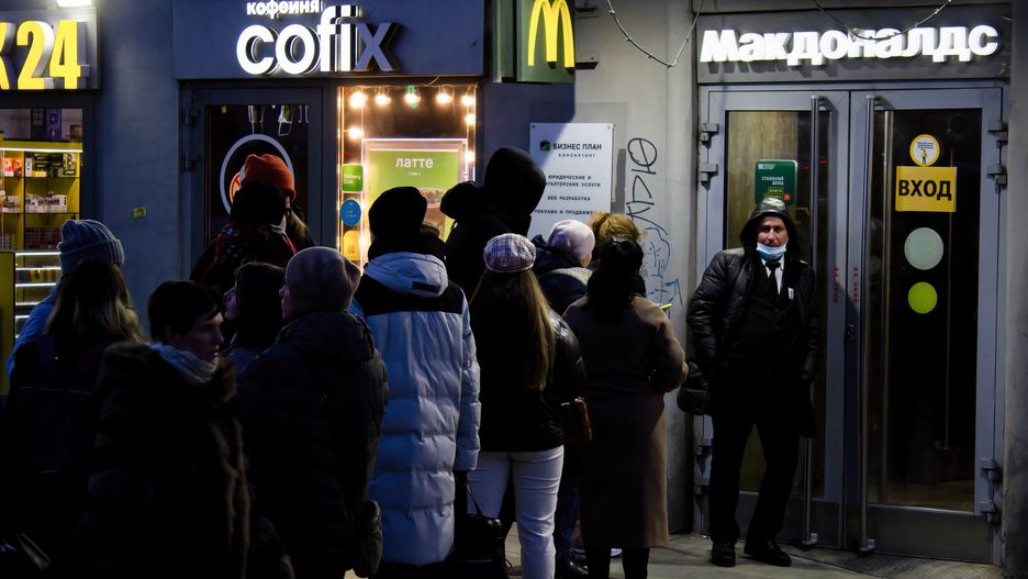 MOSCOW, RUSSIA - 2022/03/11: People wait in line to enter a McDonald's restaurant in Moscow. McDonald announced that they are temporarily closing its 850 restaurants in Russia, joining other foreign brands that have been recently suspending their operations and sales in Russia in light of the country's ongoing military campaign in neighboring Ukraine. (Photo by Vlad Karkov/SOPA Images/LightRocket via Getty Images)