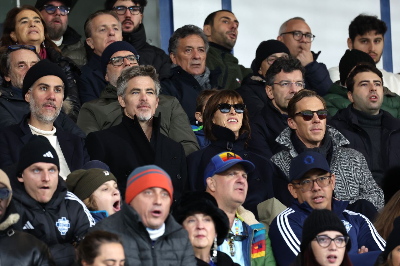 COMO, ITALY - NOVEMBER 24: Chris Pine, Sophie Hunter and Benedict Cumberbatch attend the match between Como 1907 and Fiorentina at Giuseppe Sinigaglia Stadium on November 24, 2024 in Como, Italy. (Photo by Pietro S. D'Aprano/Getty Images for Como 1907)