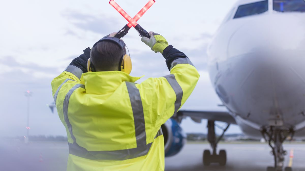 Air traffic controller guiding airplane with wand lights on tarmac
Caia Image
25-29 years, african american ethnicity, air traffic control, air traffic controller, airplane, airport, airport runway, airside operator, arms raised, color image, commercial airplane, control, day, direction, gesturing, ground crew, guidance, hi-vis, holding, horizontal, man, manual worker, mode of transport, occupation, occupational health and safety, one person, operations dispatch agent, outdoors, people, photography, Poland, protection, protective workwear, rear view, reflective clothing, responsibility, safety, selective focus, signal wand, signal wand light, standing, stopping, tarmac, transportation, travel, using, waist up, wand light, watching, worker, working, young adult, young men