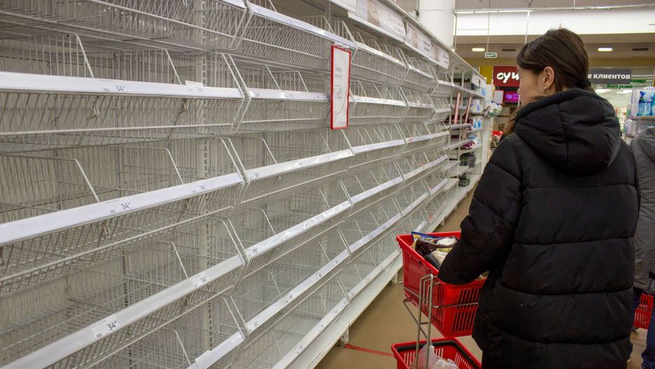A woman looks at empty shelves in a supermarket in Moscow.MOSCOW, RUSSIA - 2022/03/23: A woman looks at empty shelves in a supermarket in Moscow. There has been shortages of women's sanitary pads, diapers, and sugar after many foreign brands announced they were suspending their operations in Russia in light if the country's military operation in Ukraine. Besides these categories of goods, there has been no shortages of other fast-moving consumer goods in supermarkets in Russia. (Photo by Vlad Karkov/SOPA Images/LightRocket via Getty Images)SOPA Imageseconomy in russia, empty shelves, moscow, shortages, shortages in russia, supermarkets