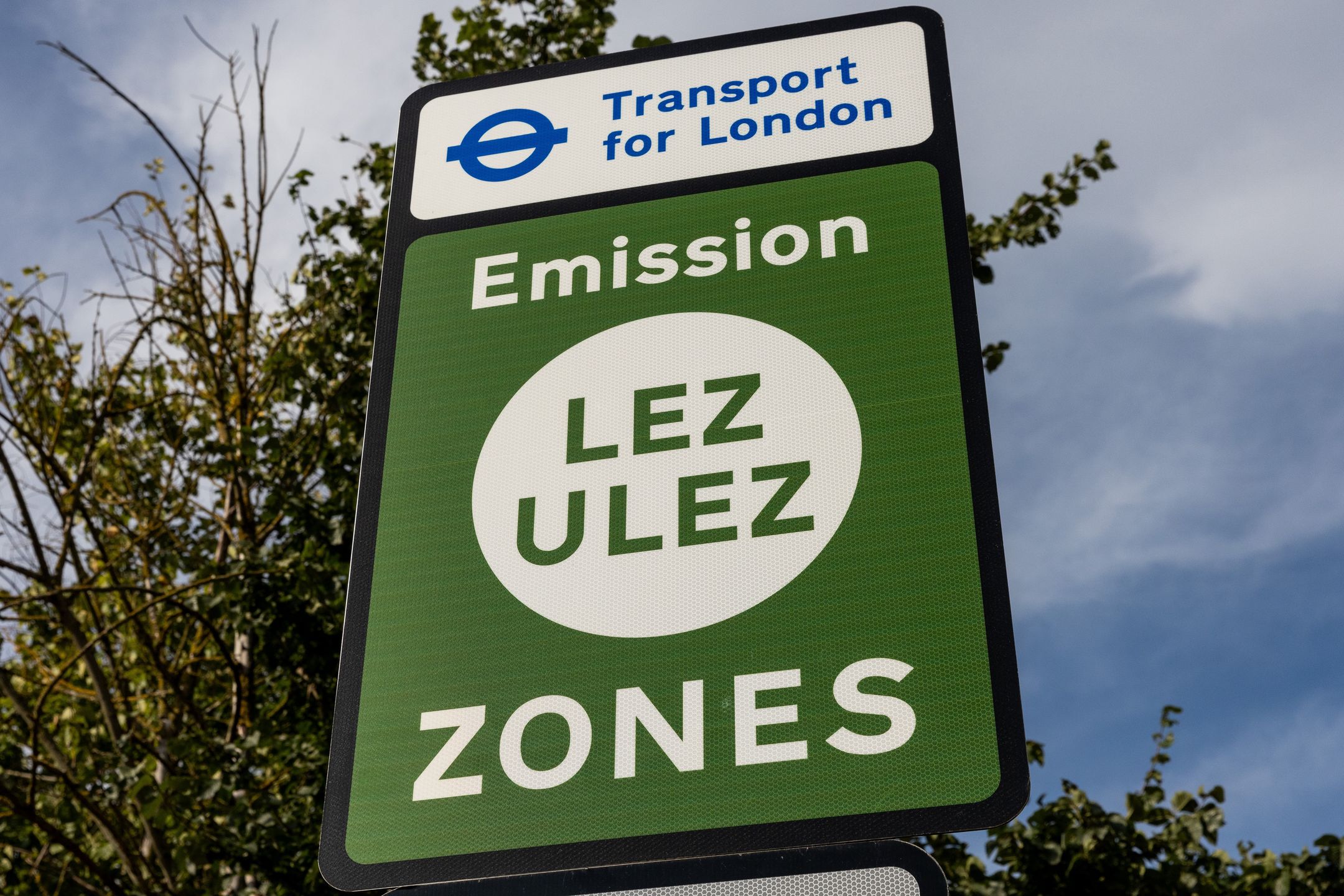 A Transport for London LEZ (Low Emission Zone) and ULEZ (Ultra Low Emission Zone) sign is pictured in Harefield on 26th September 2023 in London, United Kingdom. London's LEZ was introduced in 2008 to discourage certain types of vehicles from entering an area covering most of Greater London; the ULEZ was expanded to outer London boroughs by Mayor of London Sadiq Khan on 29th August 2023 in order to improve air quality throughout London. (photo by Mark Kerrison/In Pictures via Getty Images)