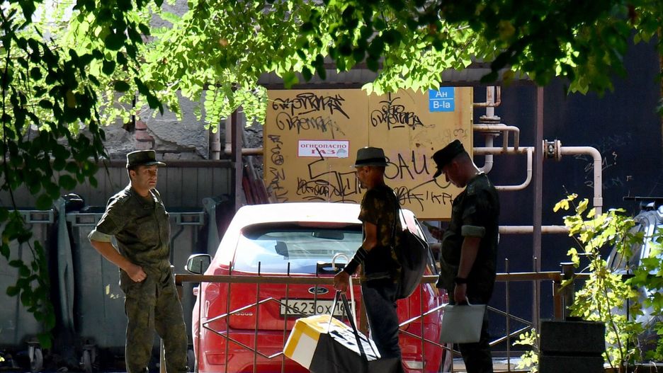 Temporary
Russian servicemen talk to each other in a yard in Southern Russian city of Rostov-on-Don on September 7, 2023, prior to Russia's local elections. Prigozhin, good or bad? In Russia, war or no war? In Rostov-on-Don, the short-lived capital of the Wagner group during its mutiny, the paradoxes and unrest within the Russian population are increased tenfold. On the flip side: everything is normal, as the Kremlin assures us. This weekend, local elections are planned in this large city located near the Ukrainian border and logistics center of the Russian army. (Photo by Olga MALTSEVA / AFP)
OLGA MALTSEVA