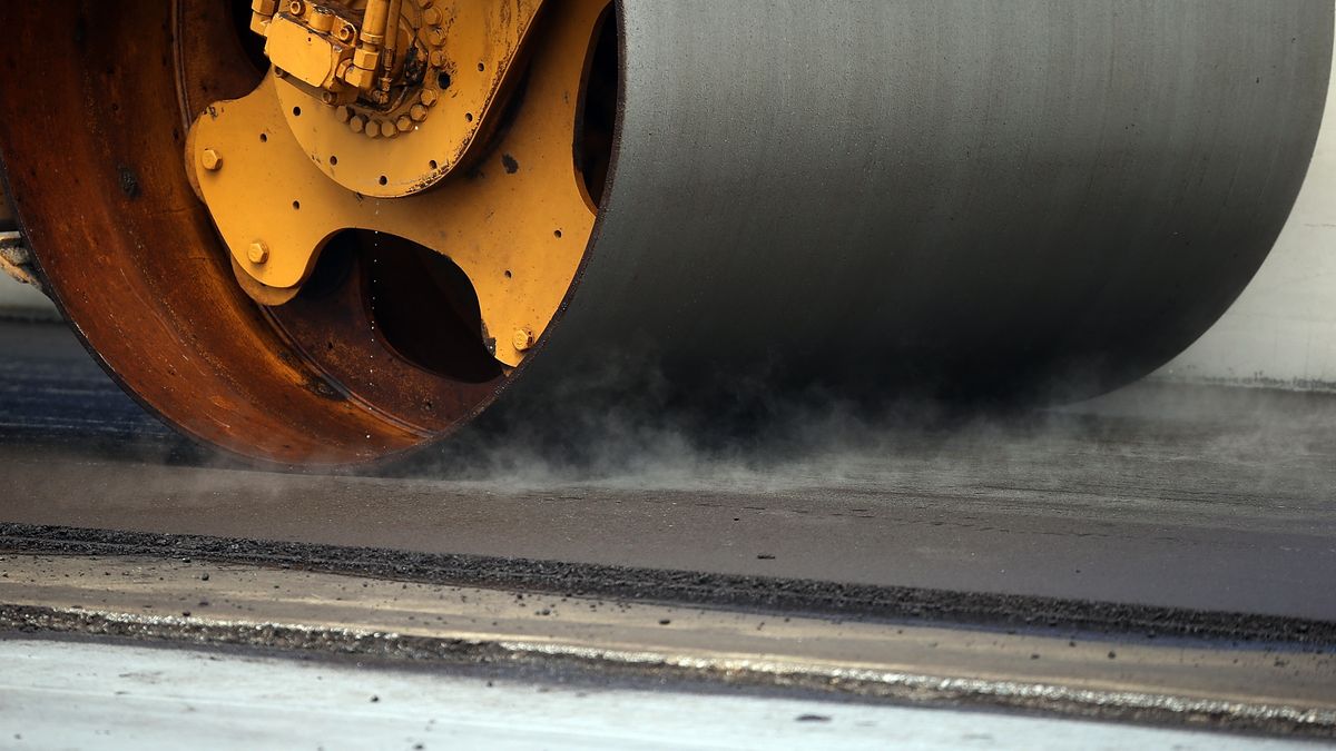Workers Pave SF-Oakland Bay Bridge As Delays Continue
OAKLAND, CA - JULY 12:  A steam roller flattens asphalt on the deck of the eastern span of the newly constructed San Francisco-Oakland Bay Bridge on July 12, 2013 in Oakland, California. Workers began paving the roadway of the newly constructed east span of the San Francisco-Oakland Bay Bridge just days after bridge officials announced that the opening of the span would be delayed once again as work continues to install large steel saddles over two seismic safety devices to fix a problem with broken bolts on two shear keys. The bridge has been under construction since 2002 with an estimated price tag of $6.3 billion and will have the world's tallest Self-Anchored Suspension (SAS) tower once completed.  (Photo by Justin Sullivan/Getty Images)
Justin Sullivan
Business, Construction, Finance