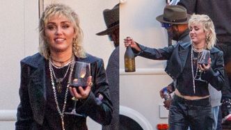 Uśmiechnięta Miley Cyrus wyprowadza na spacer kieliszek czerwonego wina (ZDJĘCIA)