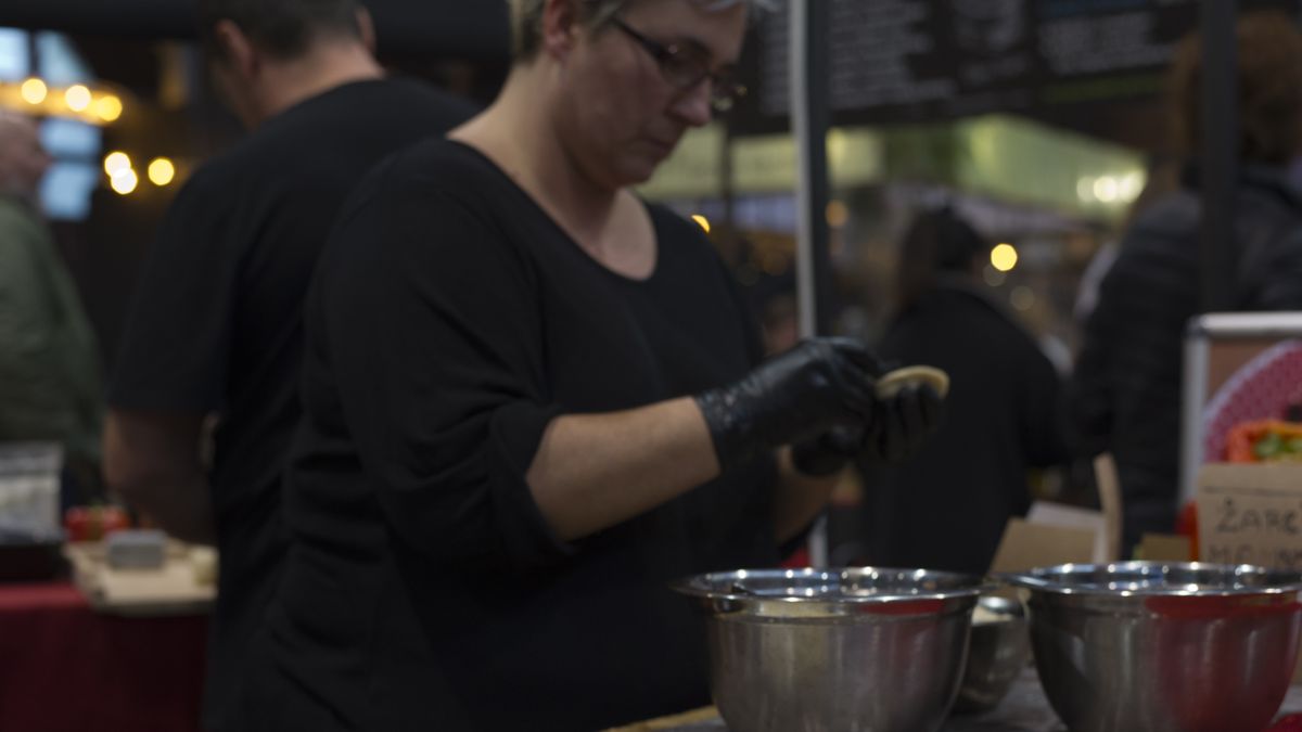 A woman fills pierogi dough during the world's dumplings festival in Warsaw, Poland on November 09, 2019. (Photo by Aleksander Kalka/NurPhoto via Getty Images)