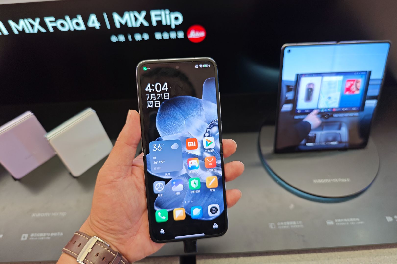 Customers are experiencing two fold-screen phones newly released by Xiaomi at a Xiaomi Home in Shanghai, China, on July 21, 2024. (Photo by Costfoto/NurPhoto via Getty Images)