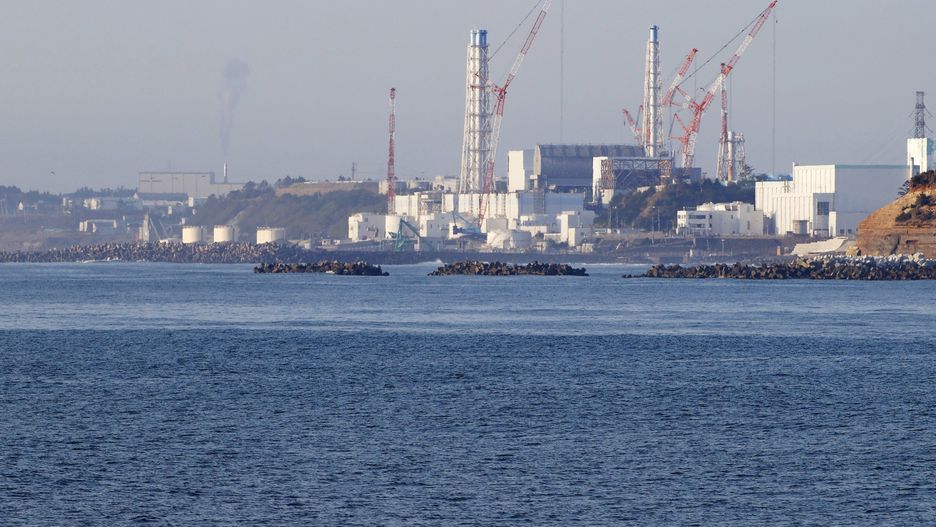Photo taken April 12, 2021, from the Fukushima Prefecture town of Namie, northeastern Japan, shows the Fukushima Daiichi nuclear power plant crippled in the March 2011 earthquake and tsunami. (Photo by Kyodo News via Getty Images)