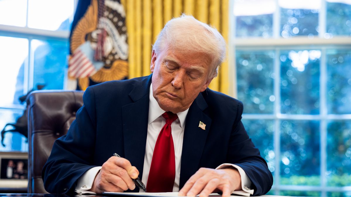 US President Donald Trump signs an executive order in the Oval Office of the White House in Washington, DC, US, on Wednesday, March 26, 2025. Trump said he will be implementing a 25% tariff on auto imports, expanding a trade war designed to bring more manufacturing jobs to the US and setting the stage for an even broader push on levies next week. Photographer: Francis Chung/Politico/Bloomberg via Getty Images