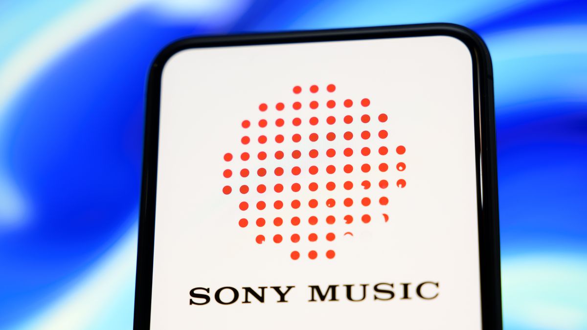 In this photo illustration, the Sony Music logo is displayed on a cell phone against a blue abstract background in Creteil, France, on November 26, 2025. (Photo Illustration by Samuel Boivin/NurPhoto via Getty Images)