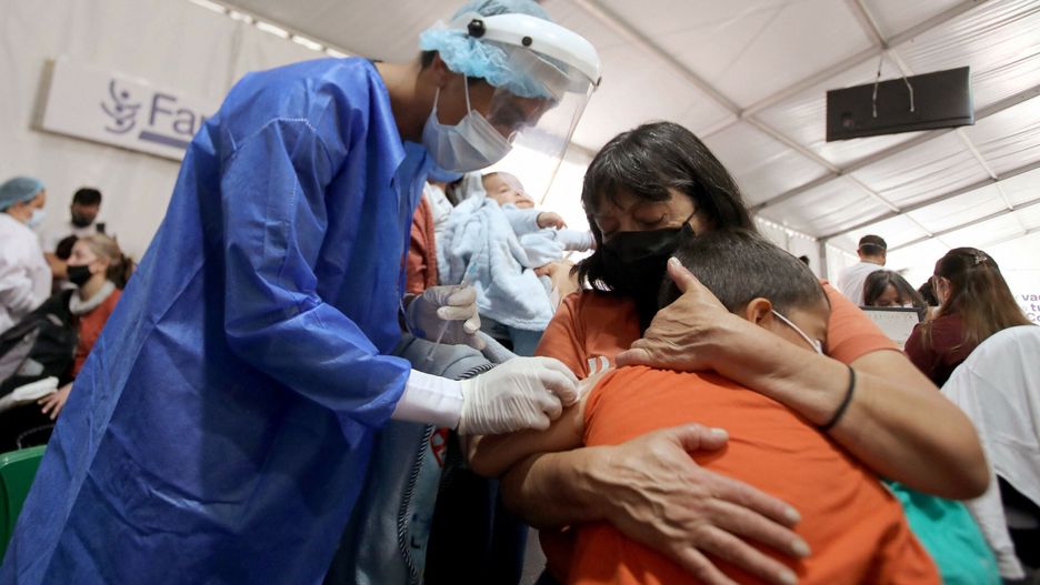 TemporaryA boy receives a dose of a vaccine against COVID-19 at a vaccination point in Bogota, on December 21, 2021. - Colombian health authorities detected the first three cases of the Omicron variant of COVID-19 in passengers who arrived from the US and Spain. (Photo by DANIEL MUNOZ / AFP)DANIEL MUNOZ