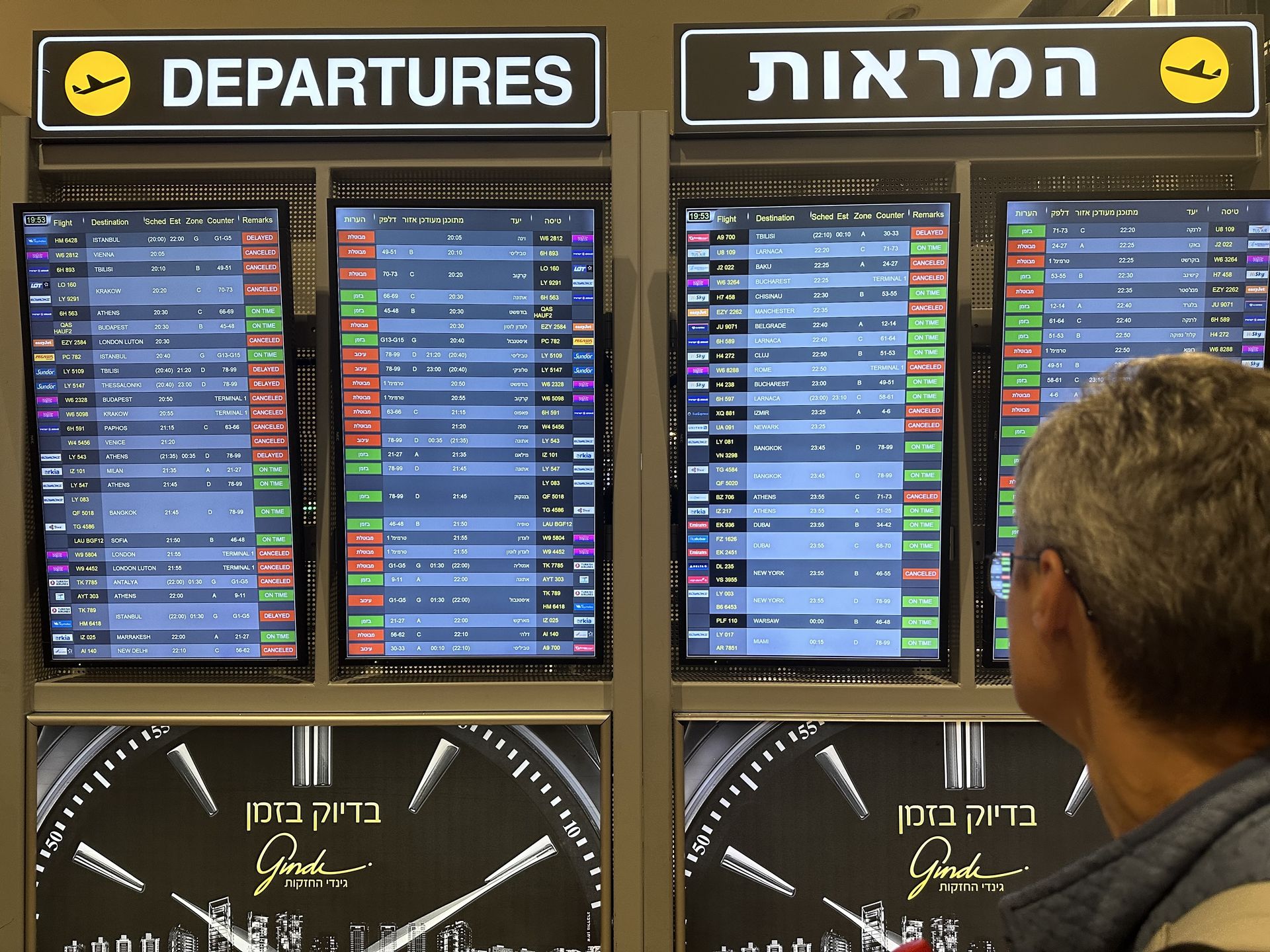 TEL AVIV, ISRAEL - OCTOBER 8: A man looks at the board showing departure schedules at Ben Gurion Airport, Israel's only international airport, after many flights from abroad are cancelled due to the attacks launched by Palestinian factions in Tel Aviv, Israel on October 8, 2023. (Photo by Turgut Alp Boyraz/Anadolu Agency via Getty Images)