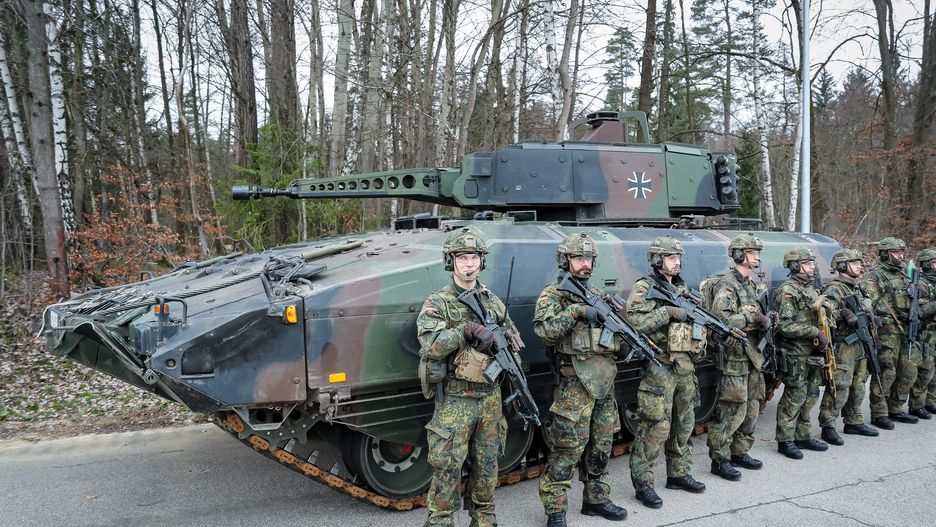 OBERVIECHTACH, GERMANY - FEBRUARY 28: Soldiers stand in front of the Puma infantry fighting vehicle during a visit of German Defence Minister Boris Pistorius at the Bundeswehr Panzergrenadierbataillon 122 armoured infantry battalion prior to the unit's deployment to Poland and then Lithuania on February 28, 2024 in Weiden, Germany. A total of three battalions are preparing today to ship east to take part in the ongoing NATO Steadfast Defender military exercises. Afterwards they will continue to Lithuania, where Germany is expanding its presence in leading a NATO multinational contingent. (Photo by Leonhard Simon/Getty Images)