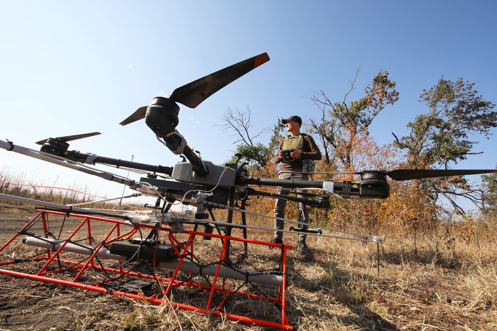 KHARKIV REGION, UKRAINE - OCTOBER 01, 2023 - Representatives of the Postup NGO inspect a mined area with a drone as part of demining works, Kharkiv Region, north-eastern Ukraine. (Photo credit should read Vyacheslav Madiyevskyi / Ukrinform/Future Publishing via Getty Images)