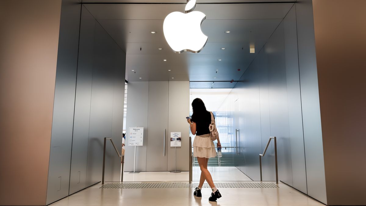 HONG KONG, CHINA - JULY 9: A pedestrian enters an Apple Store featuring the company's illuminated logo on July 9, 2026, in Hong Kong, China. Apple continues to maintain a strong retail presence in Greater China as its stores serve as key spaces for customers to experience the company's products and services. (Photo by Cheng Xin/Getty Images)