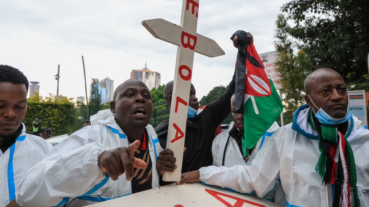 Protests erupted in Kenya against the Ebola quarantine facilities for Americans
NAIROBI, KENYA - JUNE 02: Activists wearing protective suits carry a mock coffin reading 'Ebola' as they march to protest the Kenyan government's decision to establish Ebola quarantine facilities across the country for American citizens infected with Ebola, in Nairobi, Kenya, on June 02, 2026. (Photo by Lucas Mukasa/Anadolu via Getty Images)
Anadolu
rally, activists, government decision, protective gear, quarantine facilities, demonstration, crowd, mock coffin, public health, healthcare policy, hazmat suits