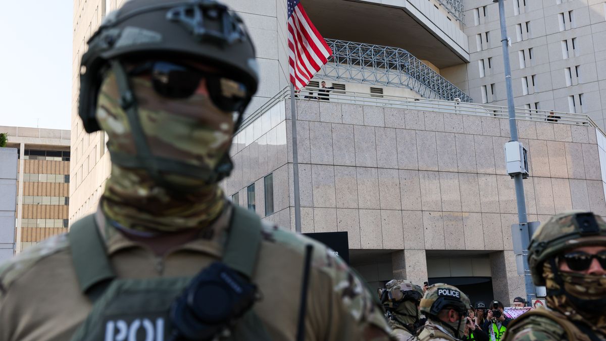LOS ANGELES, CALIFORNIA - JUNE 13: Federal agents guard outside of a federal building and Immigration and Customs Enforcement (ICE) detention center in downtown Los Angeles as demonstrations continue after a series of immigration raids began last Friday on June 13, 2025, in Los Angeles, California. Tensions in the city remain high after the Trump administration called in the National Guard and the Marines against the wishes of city leaders. (Photo by Spencer Platt/Getty Images)