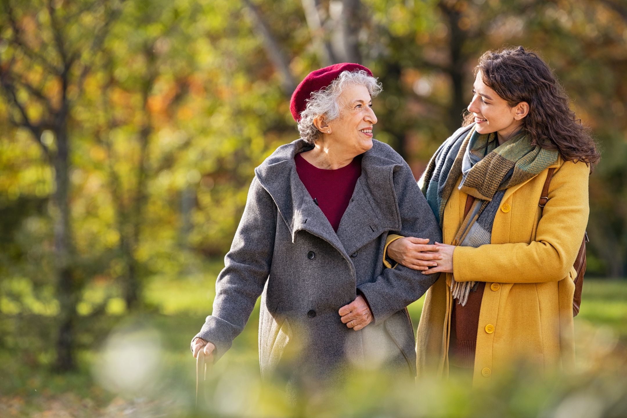 Young woman in park wearing winter clothing walking with old grandmother. Happy grandma wearing coat walking with lovely girl outdoor with copy space. Smiling lovely caregiver and senior lady walking in park during autumn and looking at each other.
francescoridolfi.com
senior, woman, grandmother, granddaughter, walking, caregiver, old, outdoor, talking, talk, love, happy, carefree, smile, smiling, care, together, help, helping, lovely, walk, girl, elder, elderly, nursing, autumn, grandma, winter, assistance, daughter, disability, disabled, embrace, enjoying, joy, enjoy, family, mother, nature, park, people, young, aged, fall, copy space, embracing, support, aging