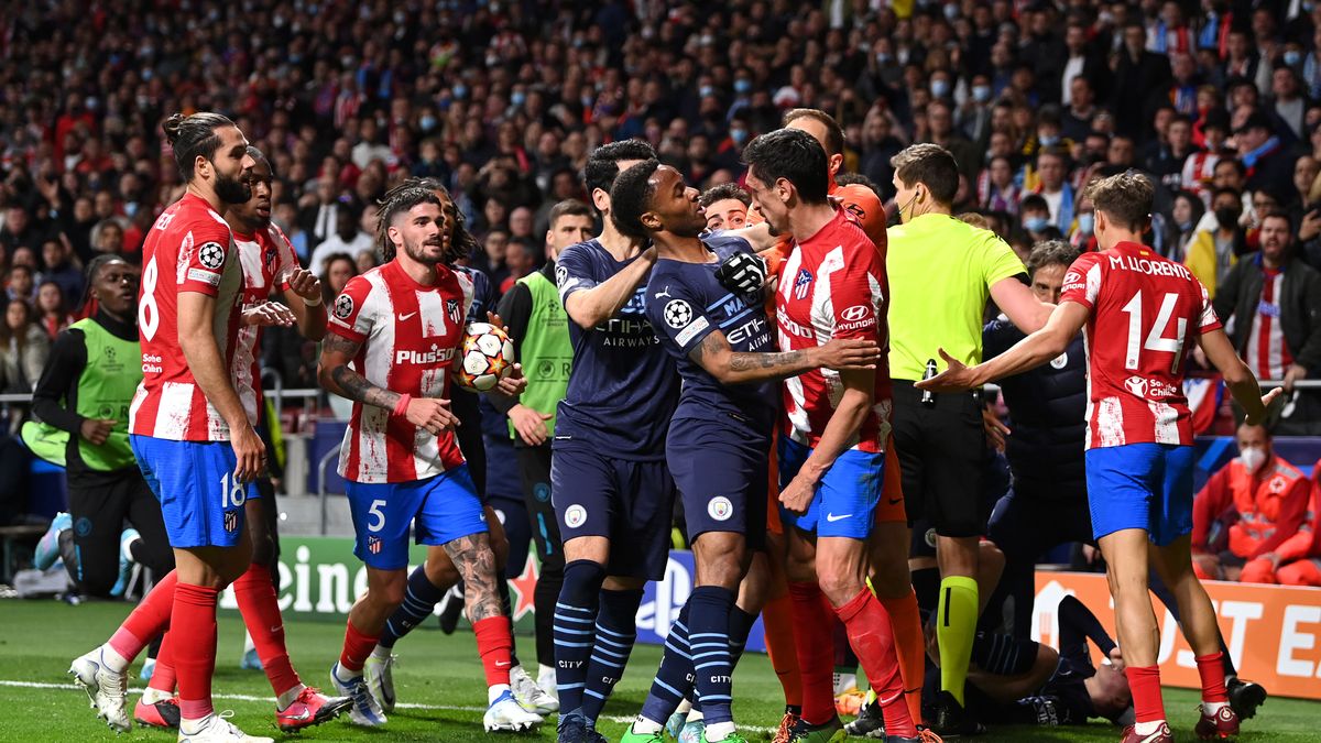 MADRID, SPAIN - APRIL 13:  Raheem Sterling of Manchester City clashes with Stefan Savic of Atletico Madrid during the UEFA Champions League Quarter Final Leg Two match between Atlético Madrid and Manchester City at Wanda Metropolitano on April 13, 2022 in Madrid, Spain. (Photo by Shaun Botterill/Getty Images)