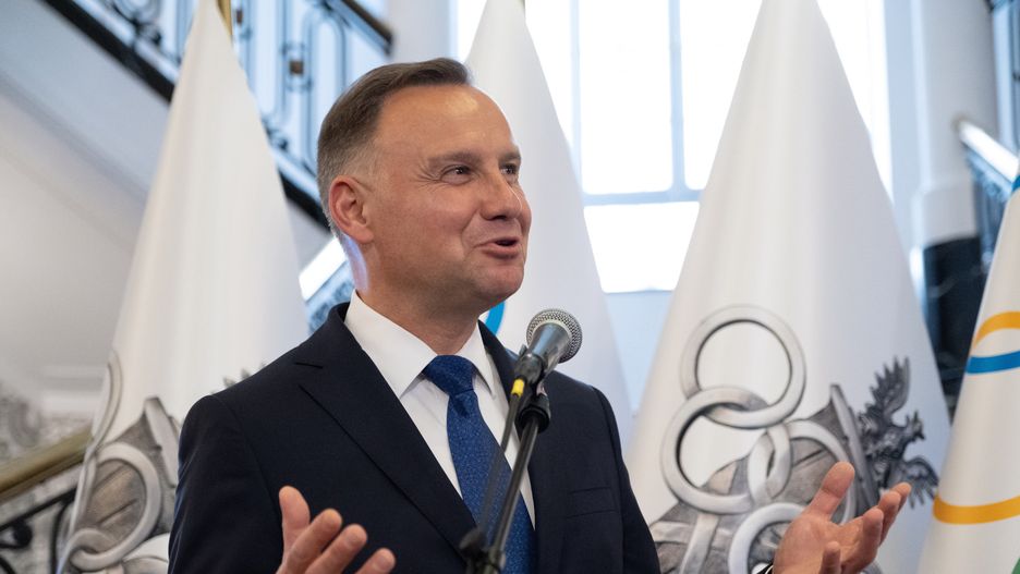KRAKóW, POLAND - 2022/07/23: Polish President Andrzej Duda, seen speaking in front of flags with Olympic symbols. The opening of the Polish club of the Olympic committee with the participation of the Polish president Andrzej Duda and the President of the International Olympic Committee Thomas Bach. (Photo by Wojciech Grabowski/SOPA Images/LightRocket via Getty Images)