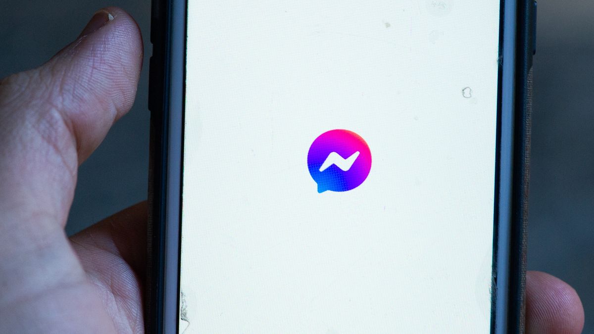 An user opening new version of Messenger in L'Aquila (Italy) on October 18, 2020. Facebook, Messenger app updates and its logo turns purple. (Photo by Lorenzo Di Cola/NurPhoto via Getty Images)
