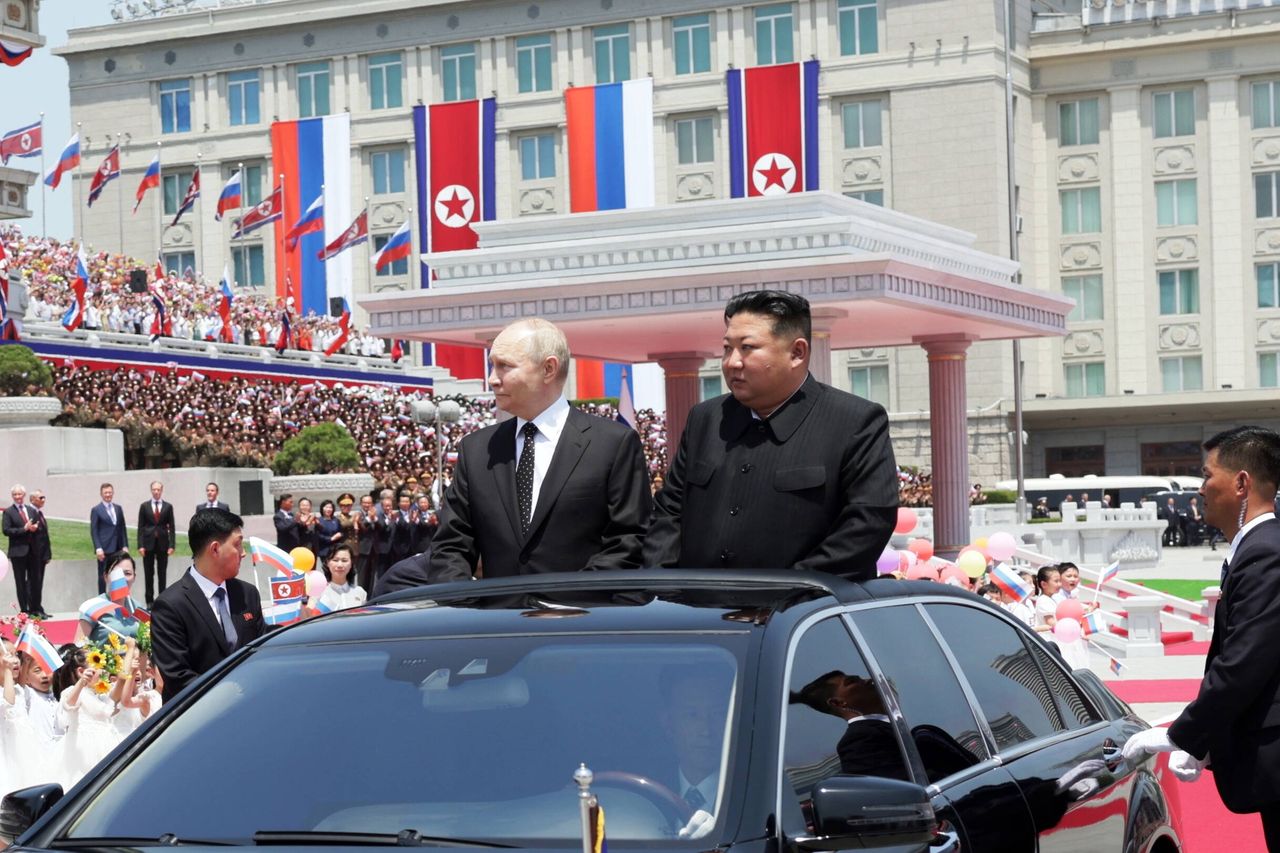 Vladimir Putin and Kim Jong Un