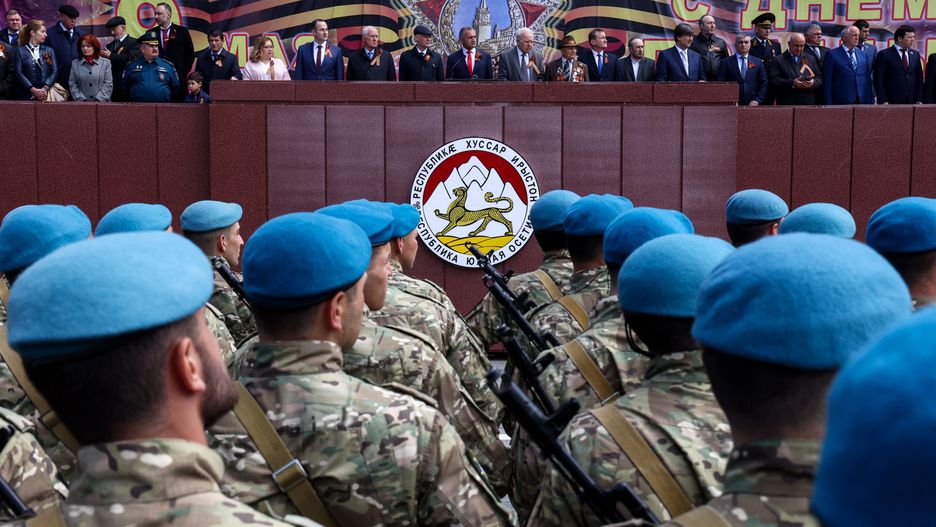 TSKHINVAL, SOUTH OSSETIA - MAY 9, 2022: Russia's Ambassador to South Ossetia Marat Kulakhmetov, South Ossetia's President Anatoly Bibilov and South Ossetia's Defense Minister Vladimir Pukhayev (L-R center) take part in a Victory Day military parade marking the 77th anniversary of the victory over Nazi Germany in World War II, in Theatre Square. Valery Sharifulin/TASS