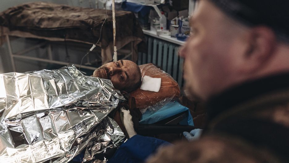 DONBASS, UKRAINE - DEC 29: Ukrainian army medics treat a wounded Ukrainian soldier on the Donbass frontline, 29 December 2022. (Photo by Diego Herrera Carcedo/Anadolu Agency via Getty Images)