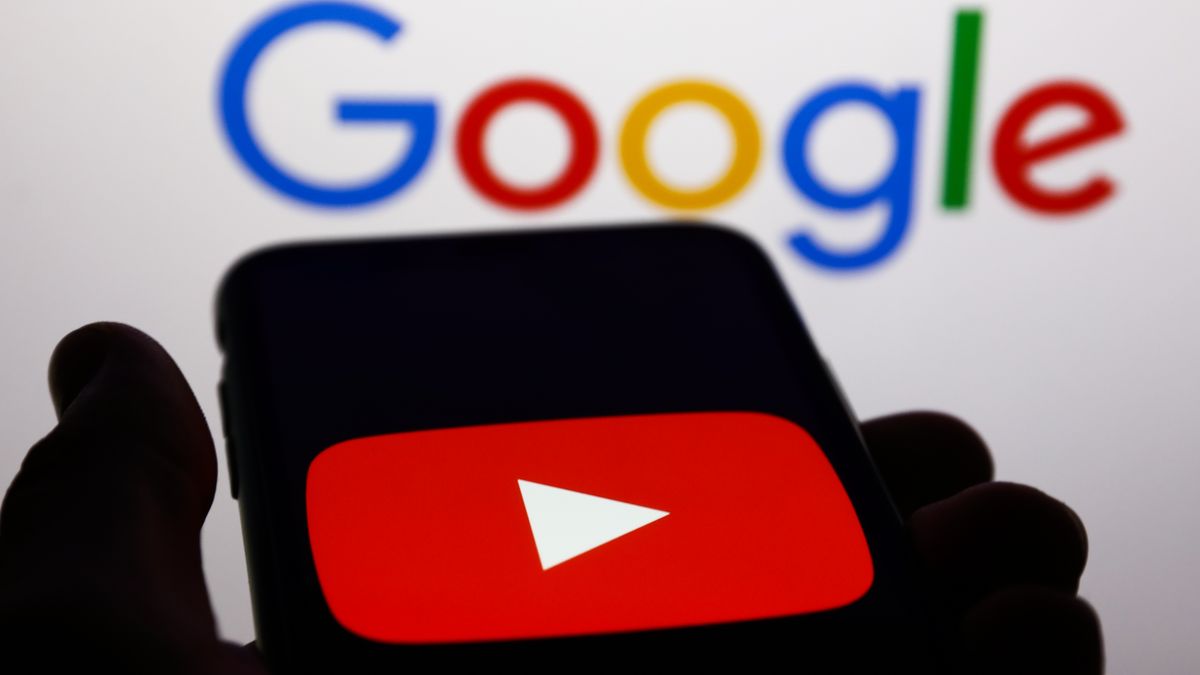 YouTube logo displayed on a phone screen and Google logo displayed on a screen in the background are seen in this illustration photo taken in Krakow, Poland on May 26, 2022. (Photo Illustration by Jakub Porzycki/NurPhoto via Getty Images)