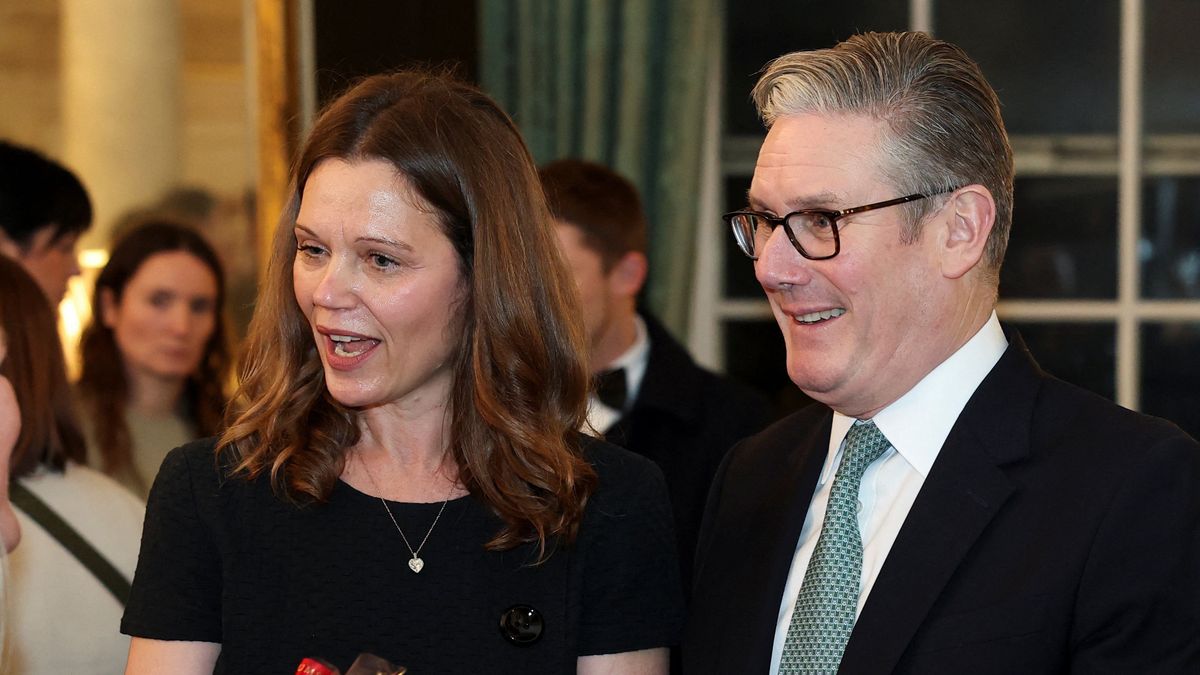 LONDON, ENGLAND - DECEMBER 1: Victoria Starmer, wife of Britain's Prime Minister Keir Starmer, holds a sample of homemade chocolates as they host a Christmas market-style showcase of small businesses at Downing Street on December 1, 2025 in London, England. (Photo by Toby Melville - WPA Pool / Getty Images)