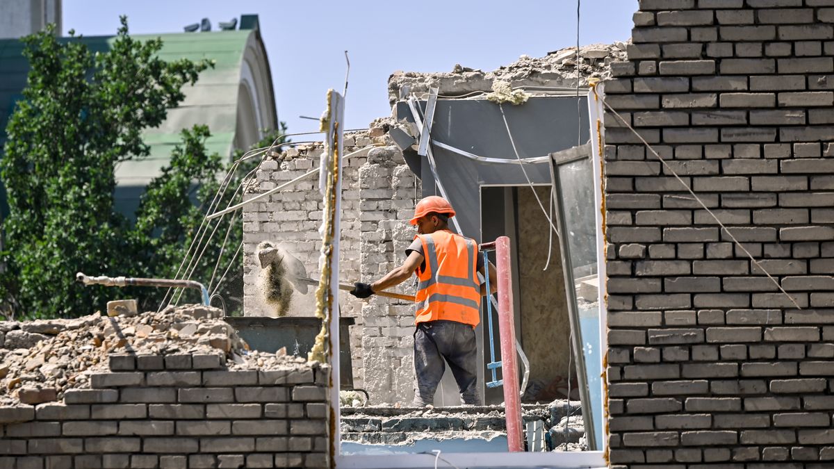A builder is working to rebuild one of the sections of the five-storey apartment building at 44 Sobornyi Avenue that was destroyed by the Russian missile attack on October 18, 2023, in Zaporizhzhia, Ukraine, on July 24, 2024. NO USE RUSSIA. NO USE BELARUS. (Photo by Ukrinform/NurPhoto via Getty Images)