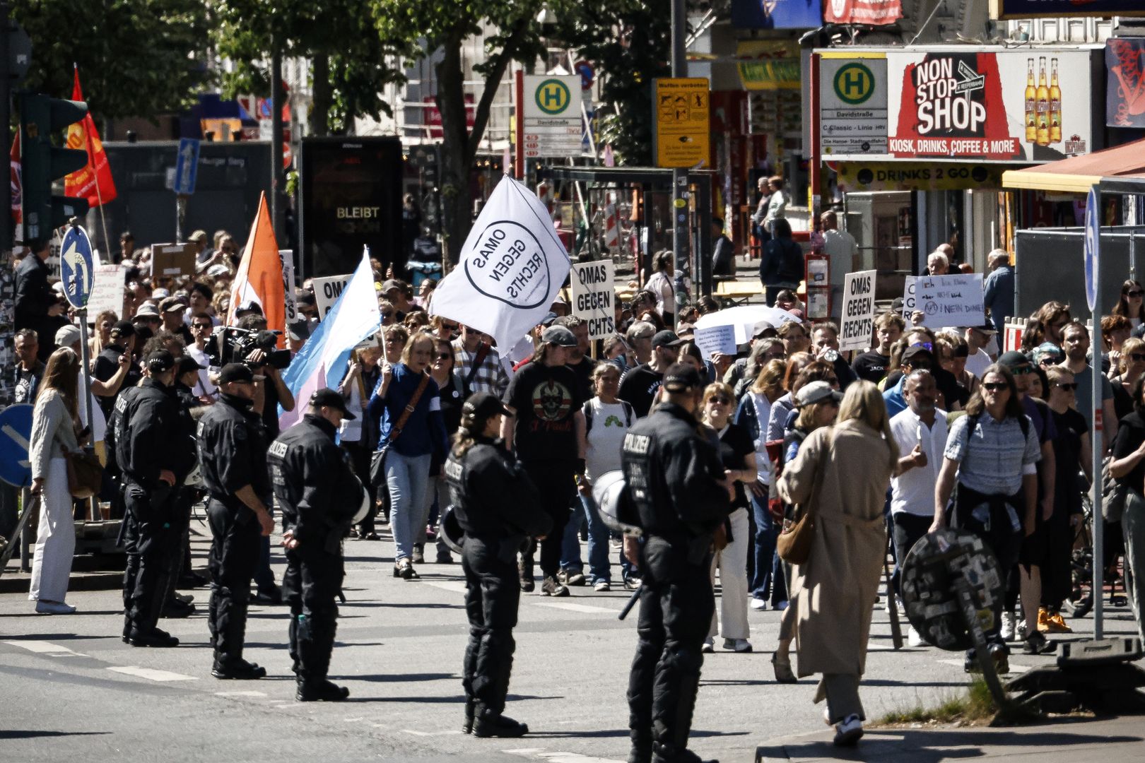 HAMBURG, GERMANY - MAY 11: People gather to protest in favor of banning the far-right Alternative for Germany (AfD) political party on May 11, 2025 in Hamburg, Germany. Similar protests are taking place nationwide today following an announcement recently by the Office for the Protection of the Constitution (Bundesamt fuer Verfassungsschutz), Germany's domestic intelligence agency, classifying the party as right-wing extremist. The AfD is countering the assessment with a court filing. (Photo by Morris MacMatzen/Getty Images)