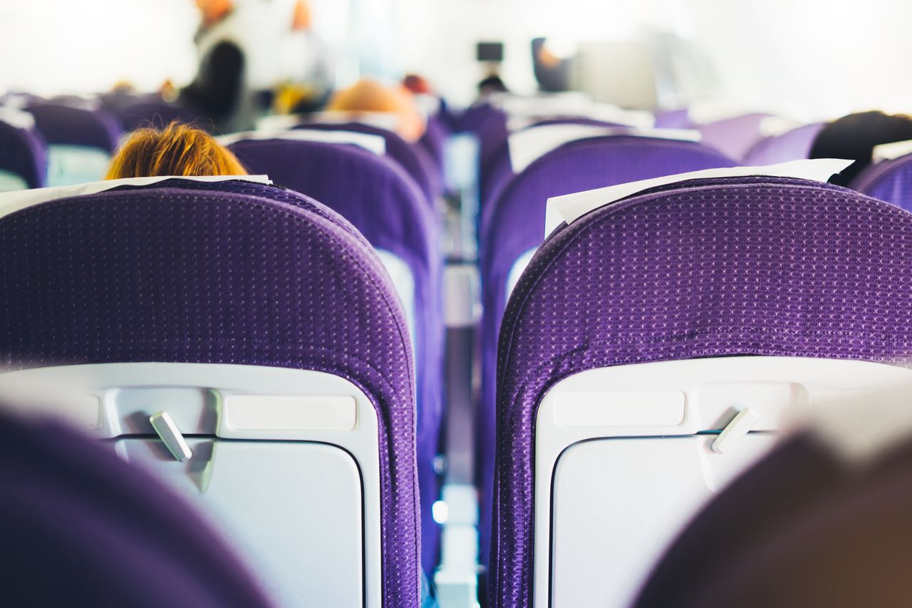Why do flight attendants sit on their hands? Here is why