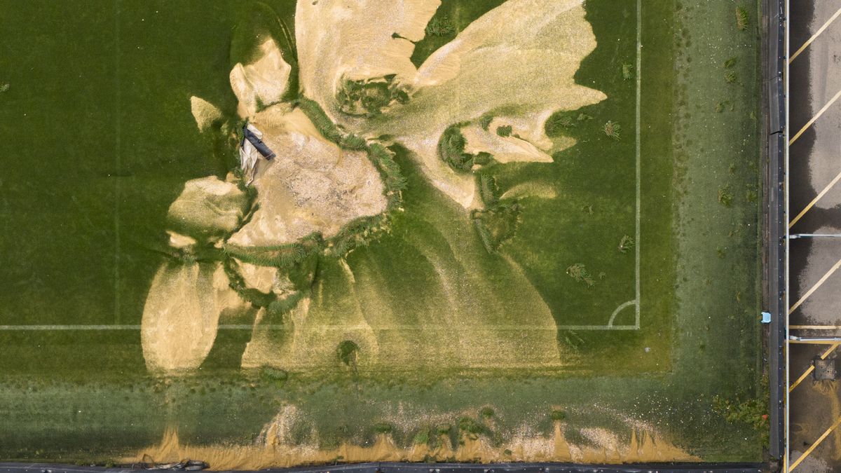 A sinkhole on the pitch at the Cherry Red Records Stadium, home of AFC Wimbledon in south west London. Parts of Britain have been struck by flash floods after some areas saw more than a month's worth of rain in 24 hours. Heavy rainfall has seen parts of Northamptonshire, Bedfordshire and London submerged causing widespread travel disruption and damage to properties. Picture date: Monday September 23, 2024. (Photo by Jordan Pettitt/PA Images via Getty Images)
