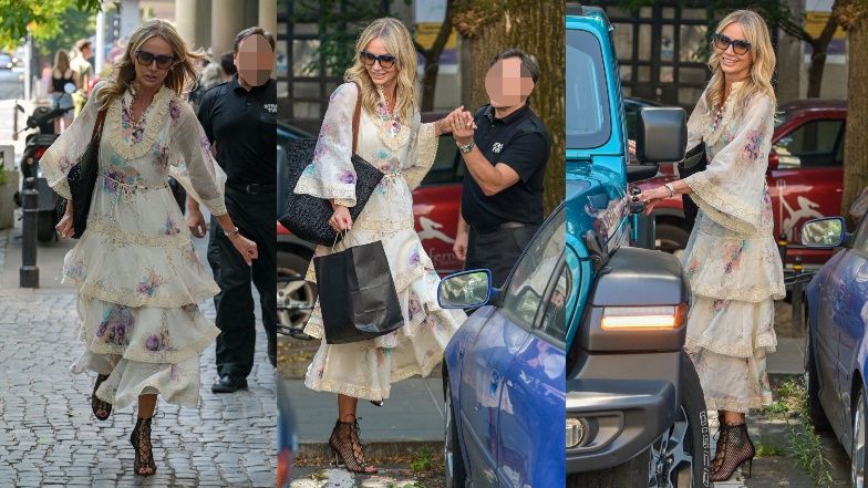 Agnieszka Woźniak-Starak wspierana przez strażnika TVN przeskakuje ogrodzenie w drodze do swego turkusowego Jeepa (ZDJĘCIA)