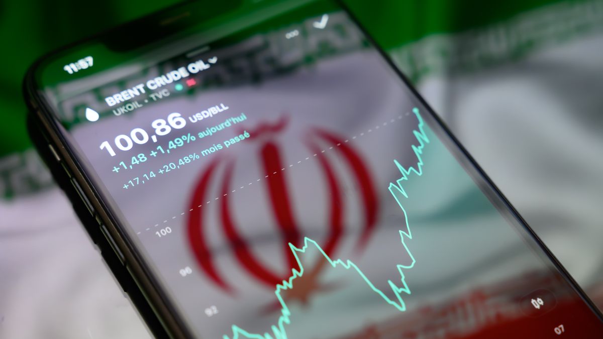 The price of Brent crude on financial markets is displayed on a smartphone screen on a reflective surface with the Iranian flag projected onto it in Creteil, France, on September 9, 2026, as Brent crude crossed the symbolic threshold of $100 per barrel following a renewed escalation of tensions in the Middle East. (Photo by Samuel Boivin/NurPhoto via Getty Images)