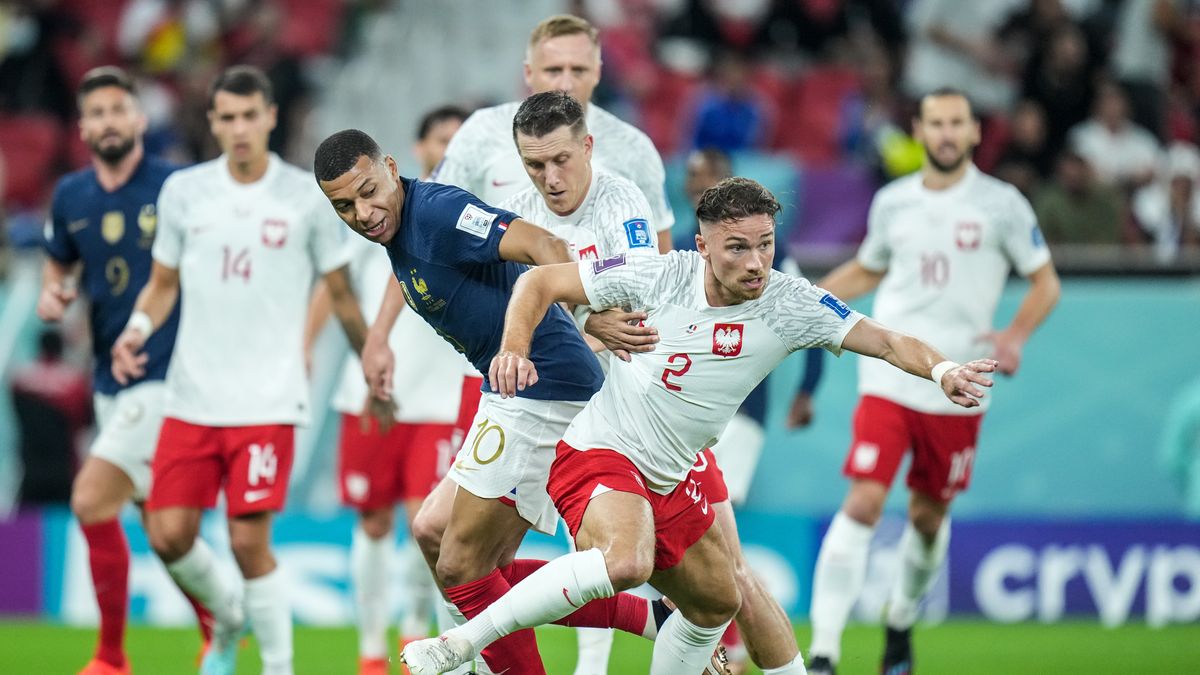 (10) MBAPPE Kylian of team France battle for ball with (2) CASH Matty and (20) ZIELINSKI Piotr of team Poland during the FIFA World Cup Qatar 2022 Round of 16 match between France and Poland at Al Thumama Stadium on 4 December 2022 in Doha, Qatar. (Photo by Ayman Aref/NurPhoto via Getty Images)